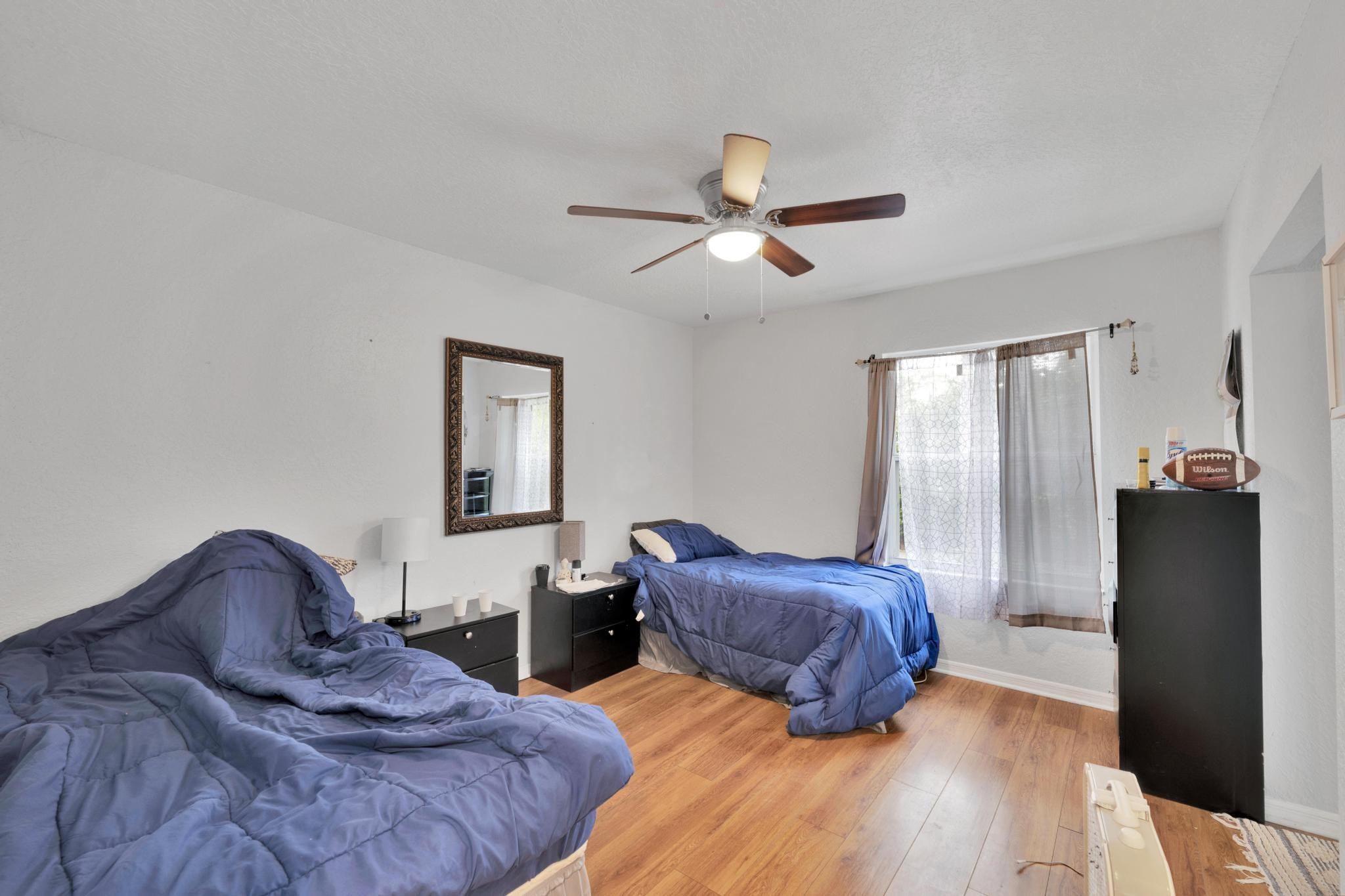 4901 Godfrey Road Parkland, FL 33067 - Photo 48 of 60 a bedroom with furniture and wooden floor