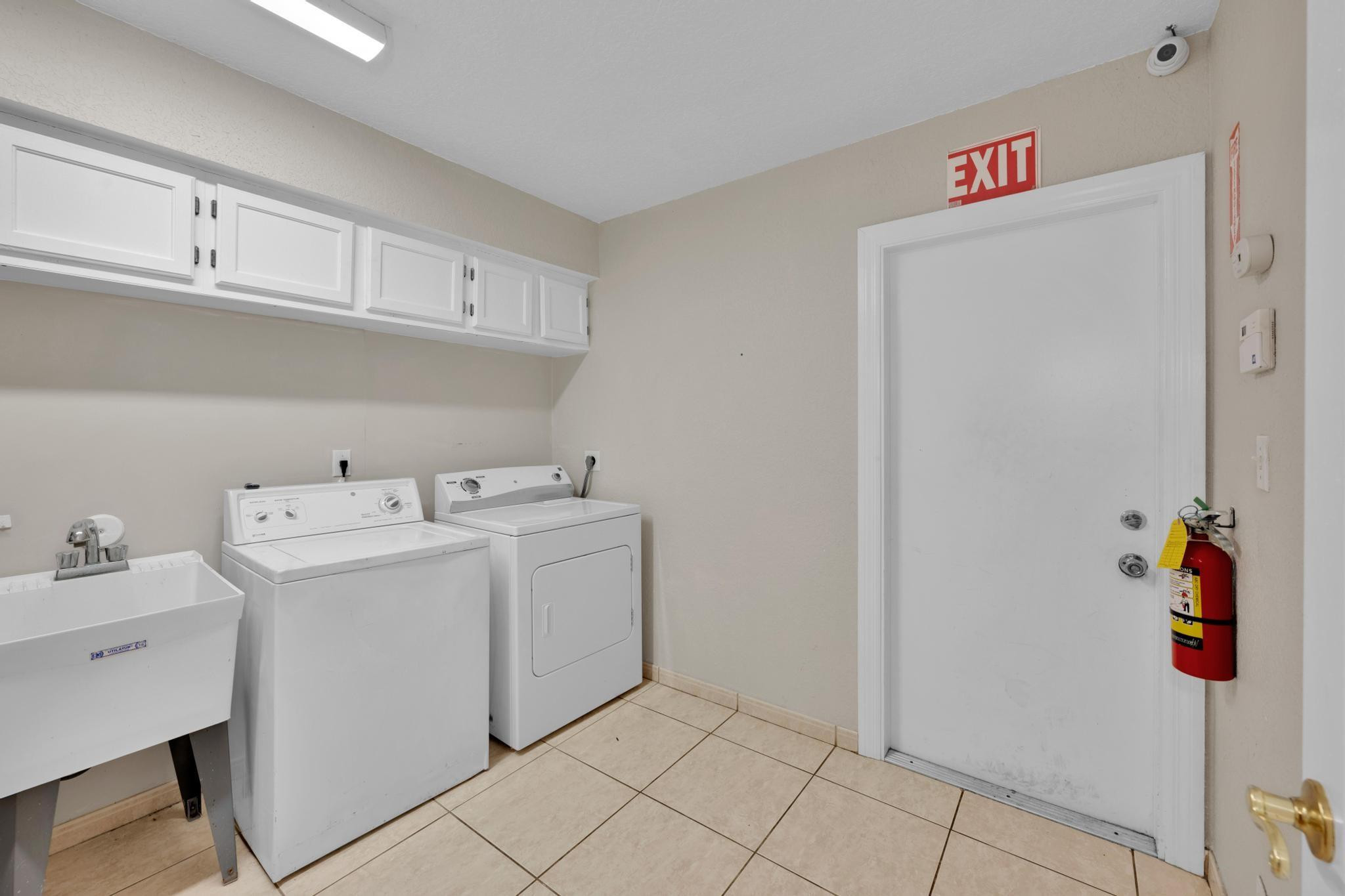 4901 Godfrey Road Parkland, FL 33067 - Photo 50 of 60 a utility room with dryer and washer