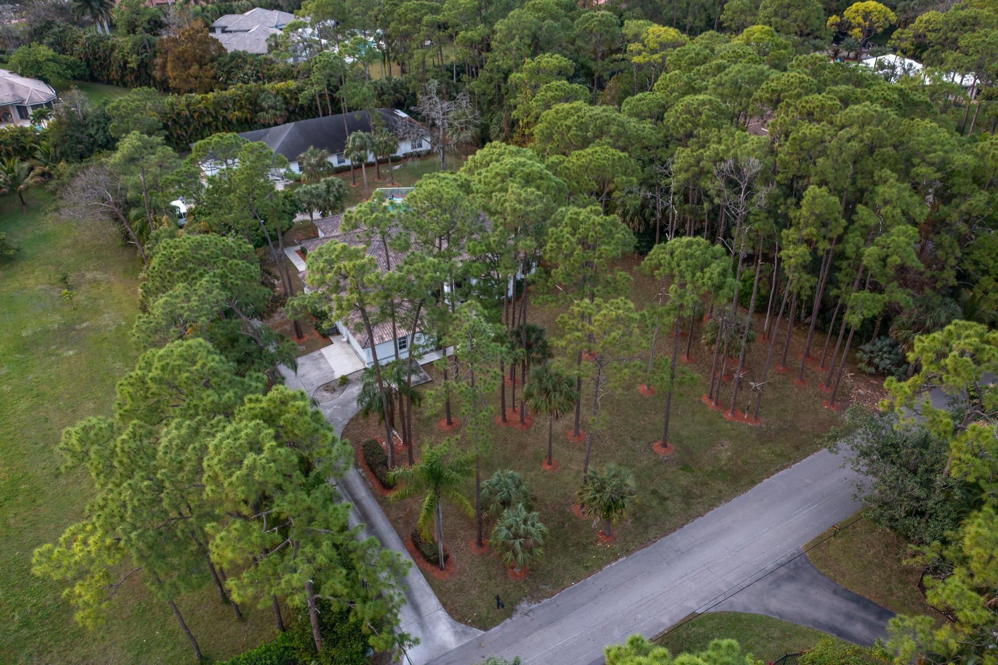 4901 Godfrey Road Parkland, FL 33067 - Photo 5 of 60 an aerial view of residential house with outdoor space and trees all around