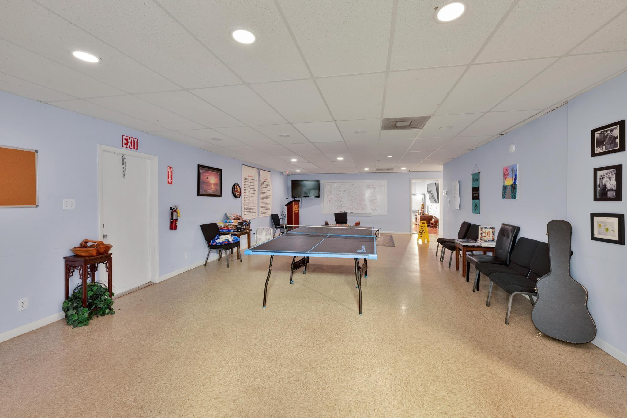4901 Godfrey Road Parkland, FL 33067 - Photo 56 of 60 a living room with furniture a table and a potted plant