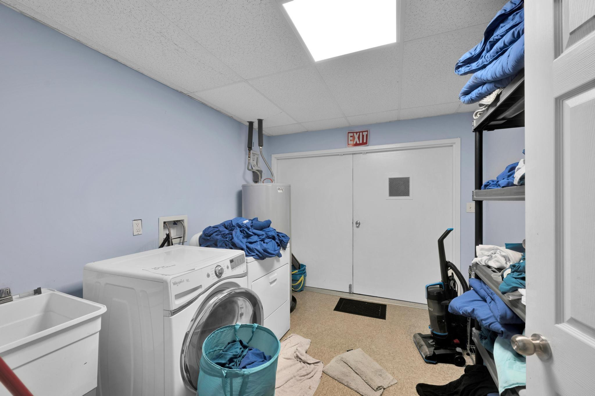 4901 Godfrey Road Parkland, FL 33067 - Photo 57 of 60 a utility room with dryer and washer