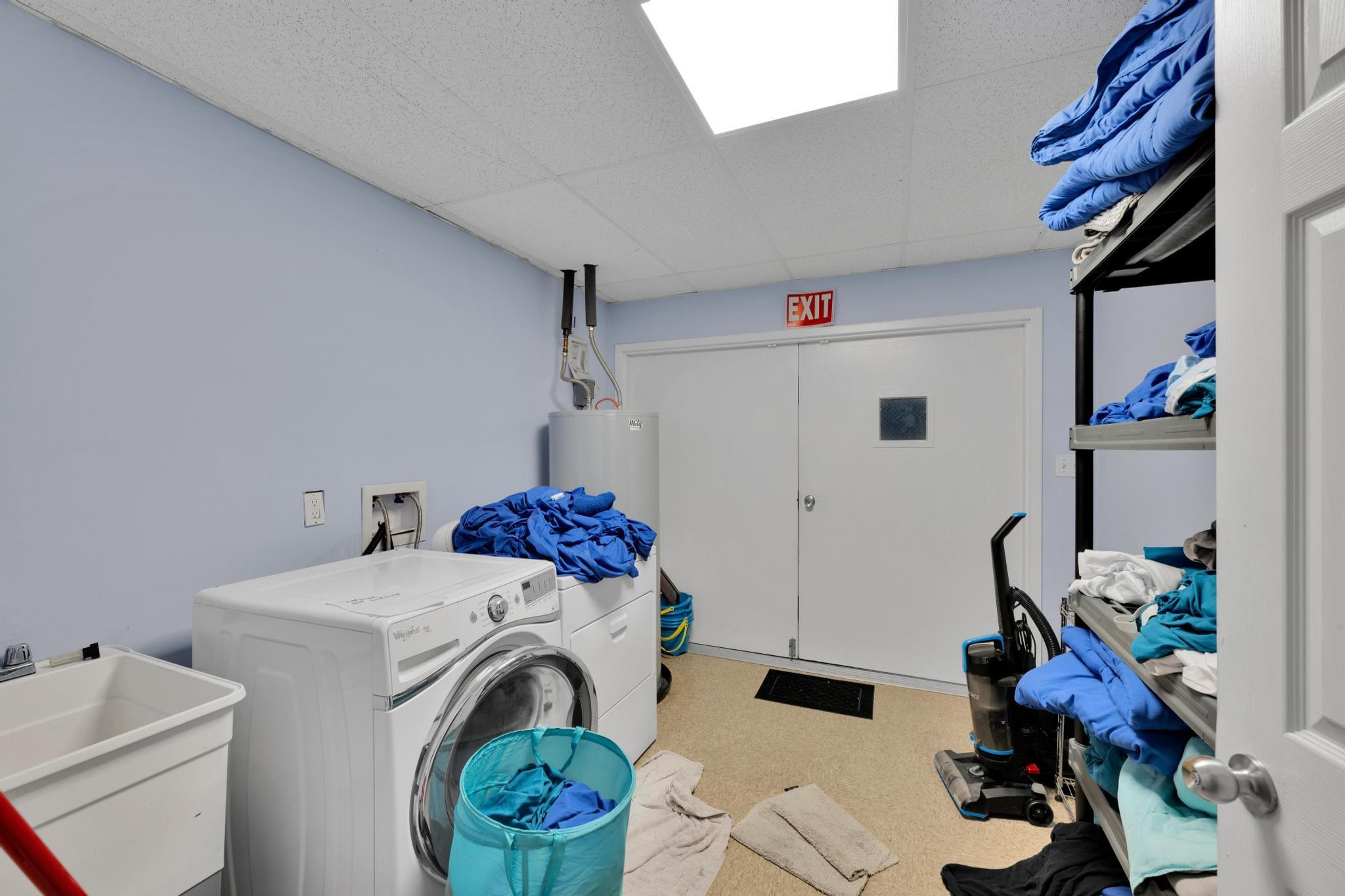 4901 Godfrey Road Parkland, FL 33067 - Photo 58 of 60 a utility room with dryer and washer