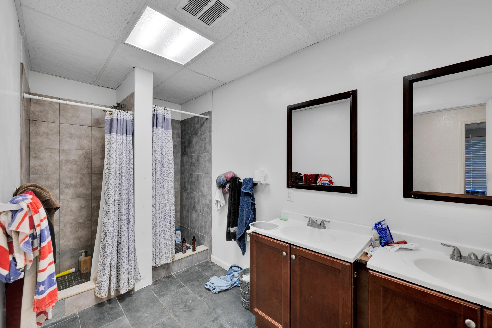 4901 Godfrey Road Parkland, FL 33067 - Photo 60 of 60 a bathroom with a sink mirror and shower