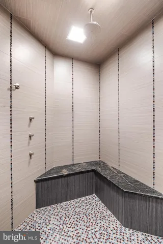 a room with pool table and windows