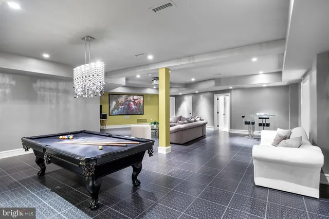 a view of a patio with a table and chairs under an umbrella