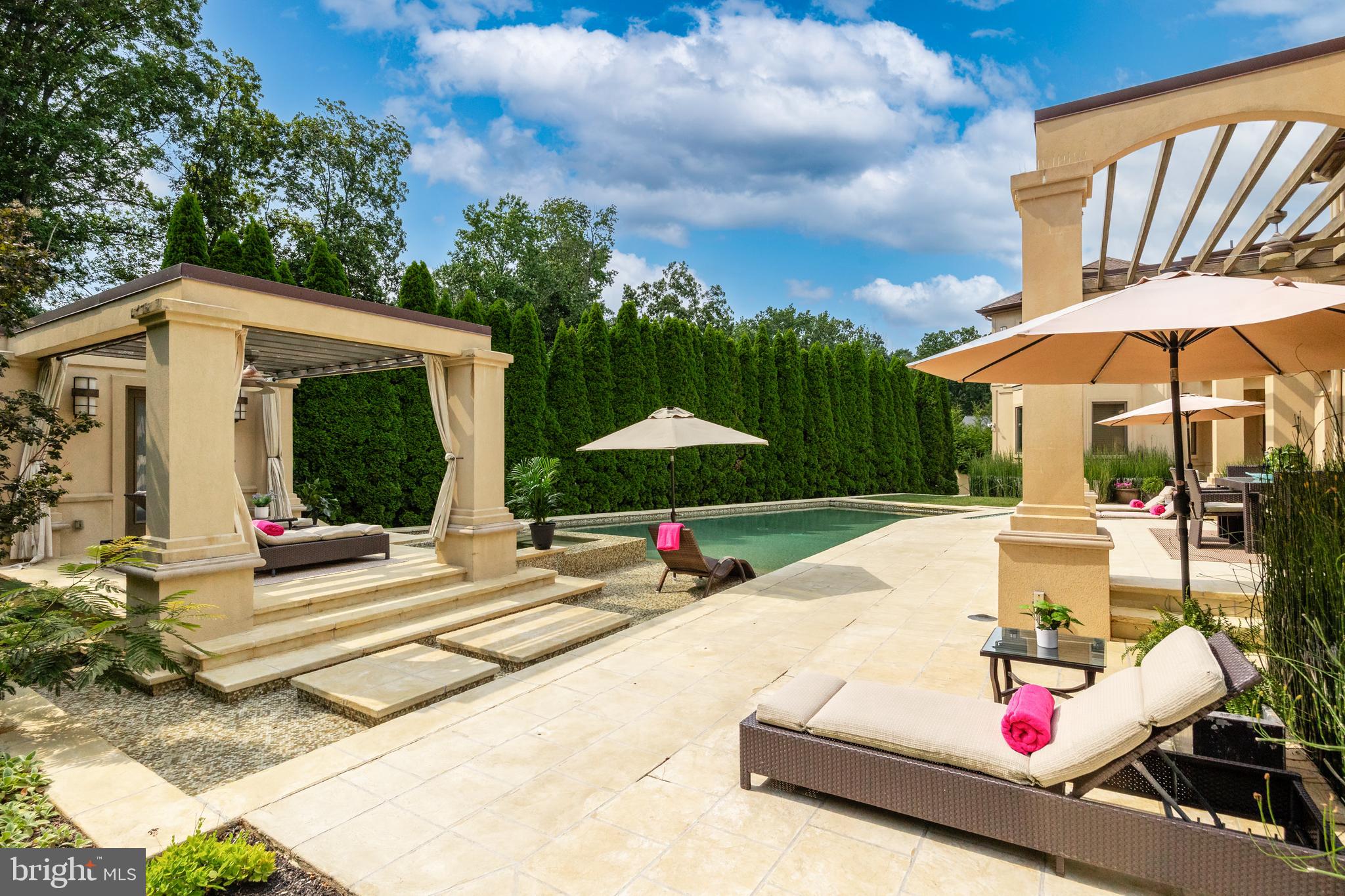 4 Southwood Drive Cherry Hill, NJ 08003 - Photo 48 of 58 a view of a patio with a table and chairs under an umbrella