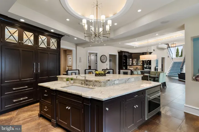 a kitchen with a stove sink and cabinets