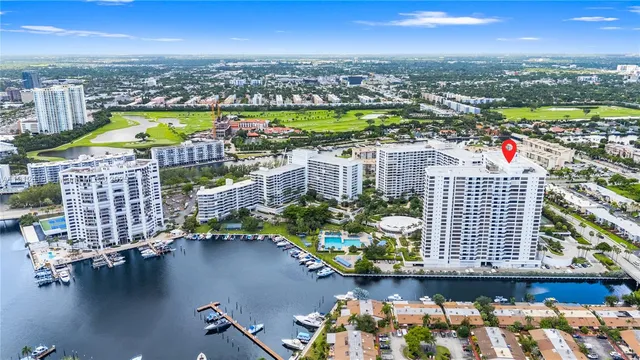 an aerial view of residential building and lake