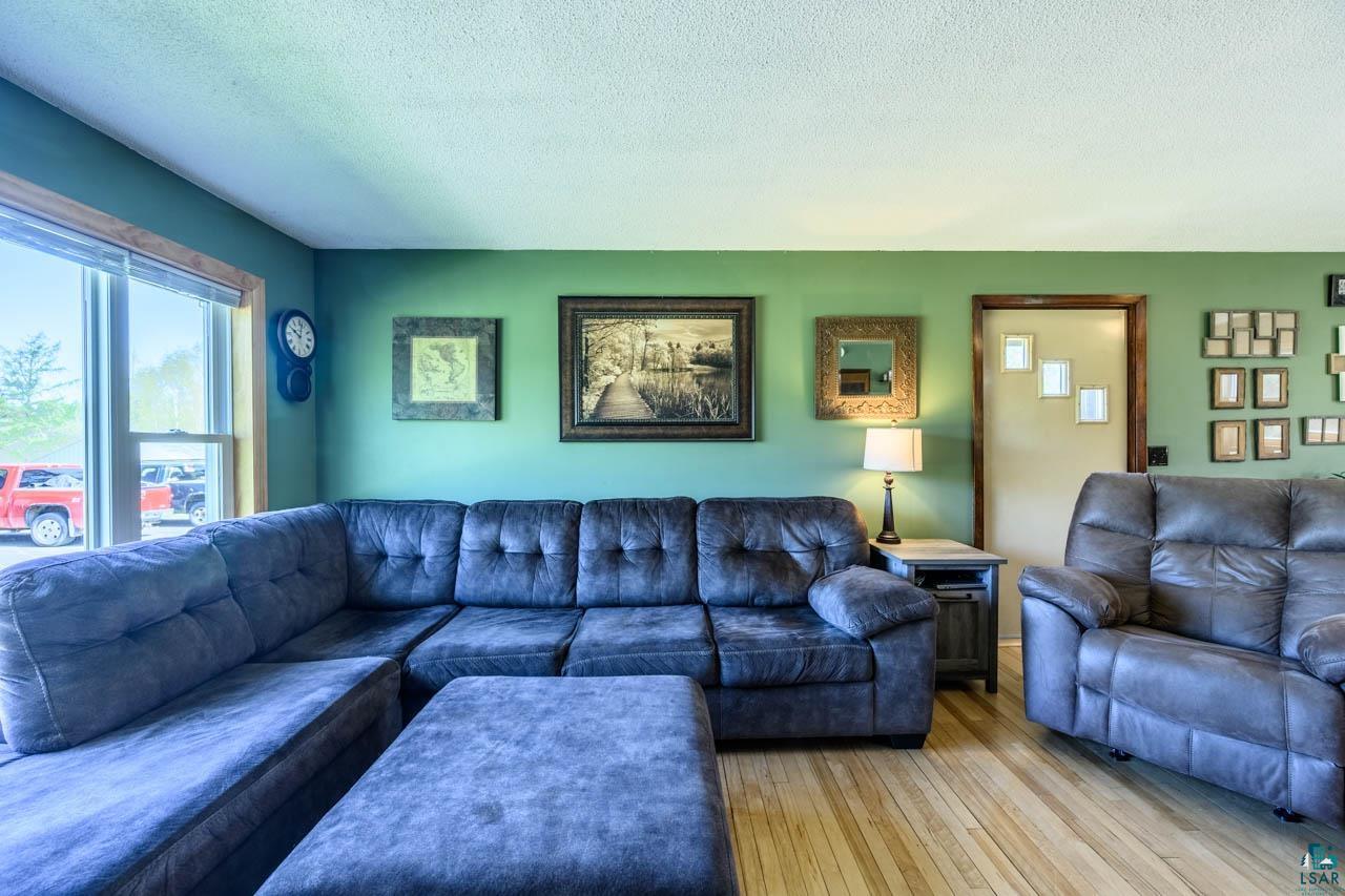 2581 O'Rourke Road Hibbing, MN 55746 - Photo 4 of 61 Bright living space featuring natural wood-finish flooring