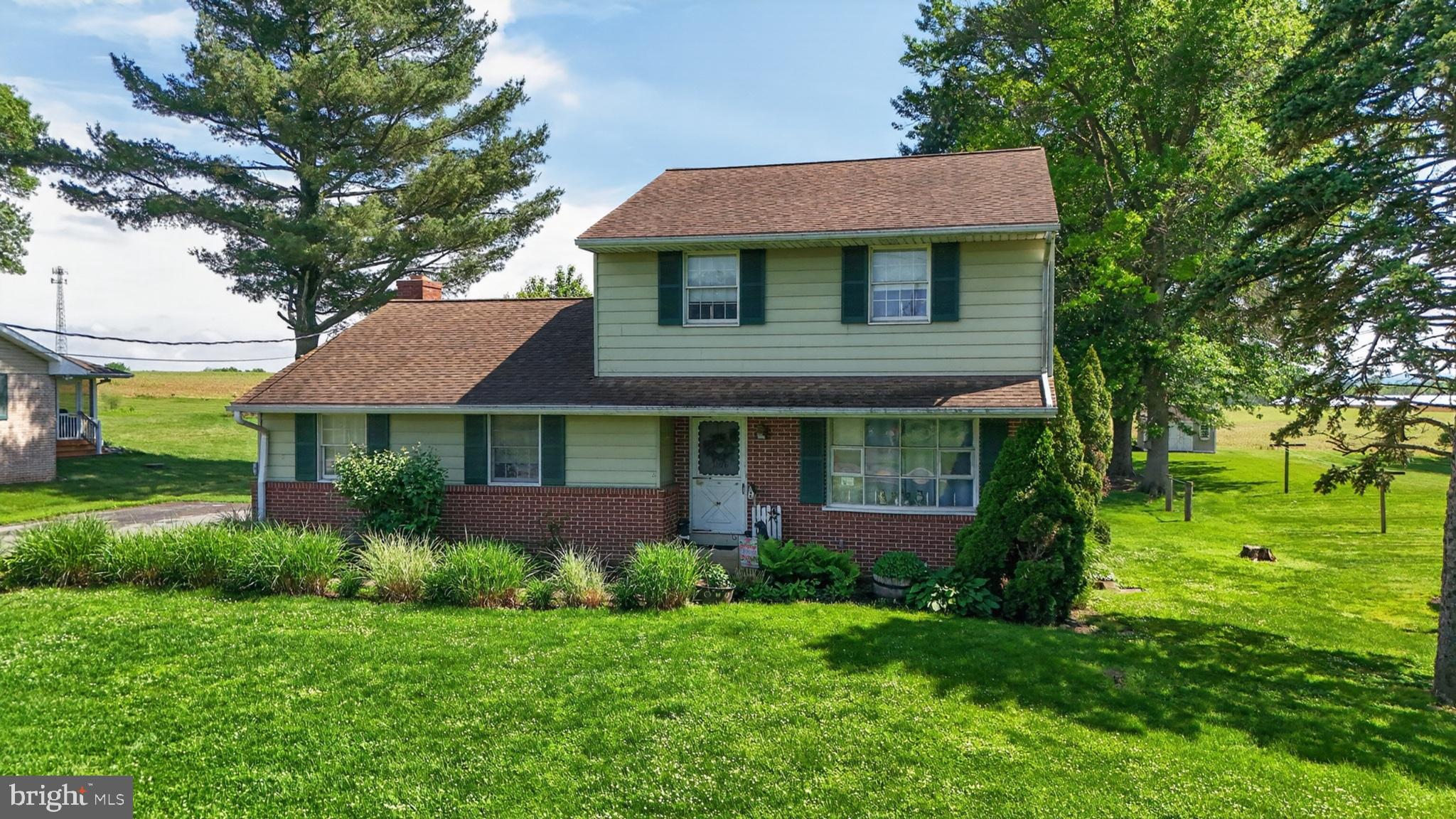 1106 Village Road Lancaster, PA 17602 - Photo 2 of 42 Charming home with lush green surroundings.