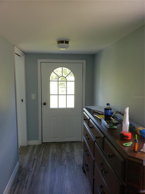 20805 Sheldon Street Orlando, FL 32833 - Photo 4 of 18 a room that has a dresser and window in it