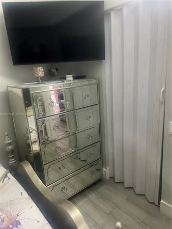 a bathroom with a sink toilet and mirror