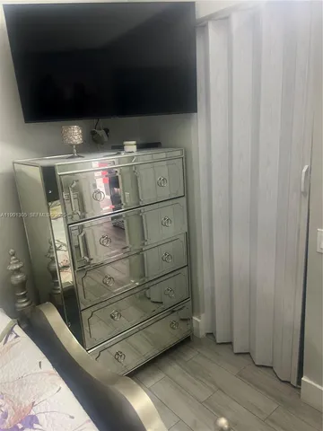 a bathroom with a sink toilet and mirror