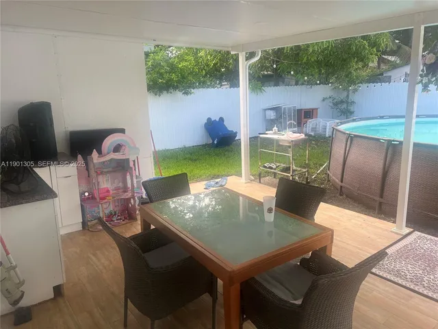 a view of a dining room with furniture window and outside view