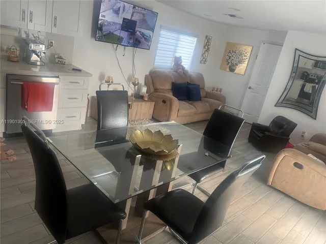 a view of a dining room with furniture
