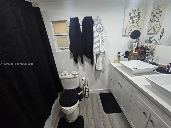 a bathroom with a sink and a toilet
