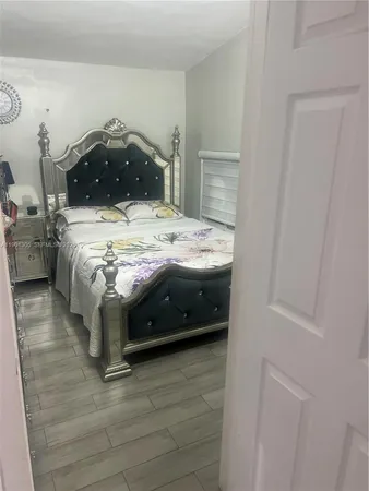 a bedroom with a bed and a closet