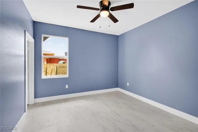 a view of room with hardwood floor and window