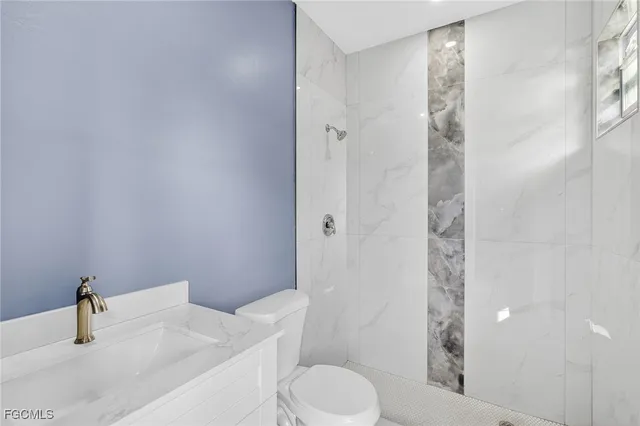 a bathroom with a sink and toilet