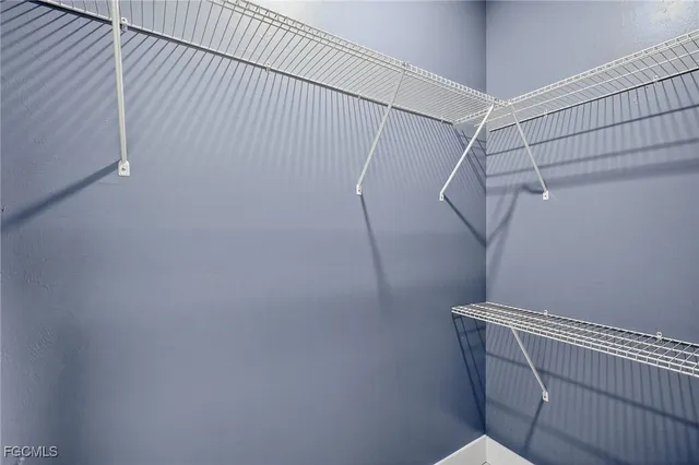 a view of a room with racks on the wall