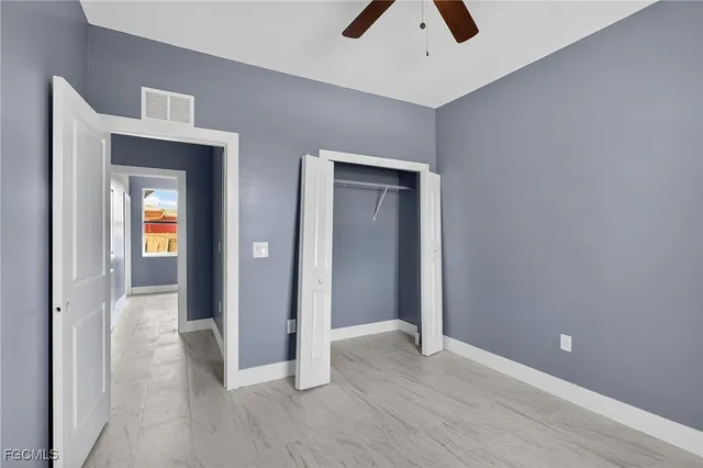 wooden floor in a hall with a window
