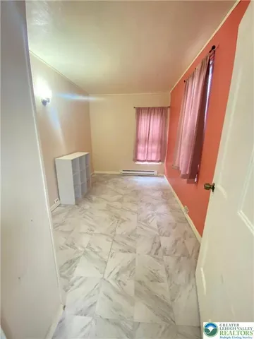 a view of a room with window and stairs