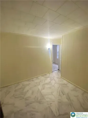 a view of an empty room and window