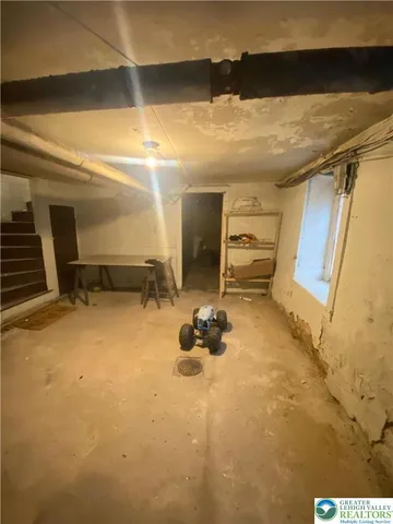 a bathroom with a sink a toilet and window