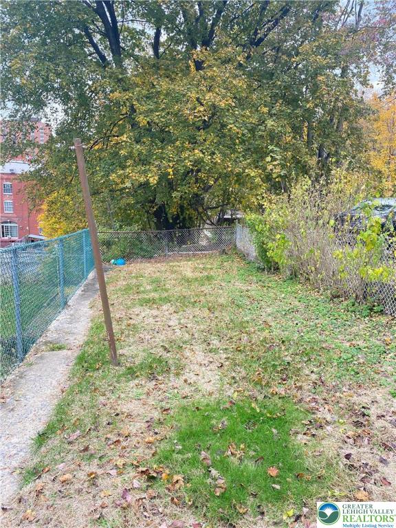 37 Hunter Street Tamaqua, PA 18252 - Photo 24 of 30 a view of a yard with plants and large trees