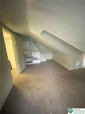 a couch sitting in a room next to a window