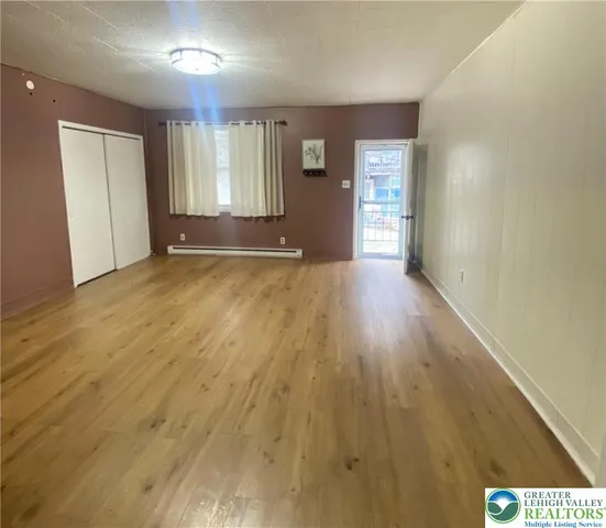 a view of an empty room and window