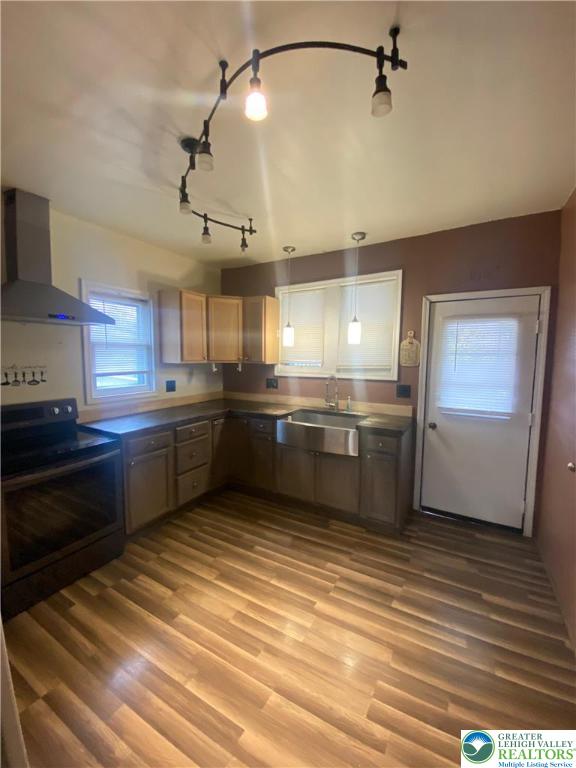 37 Hunter Street Tamaqua, PA 18252 - Photo 8 of 30 a kitchen with stainless steel appliances a sink cabinets and wooden floor