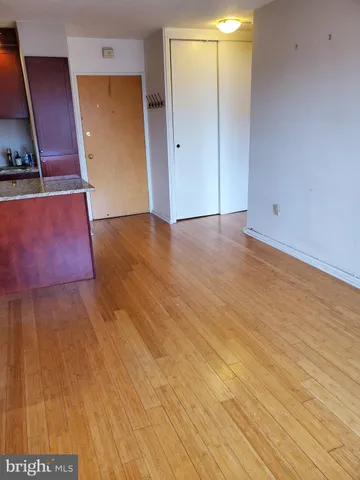 a view of a kitchen with wooden floor