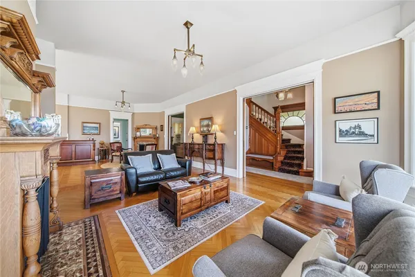 a living room with furniture and a rug