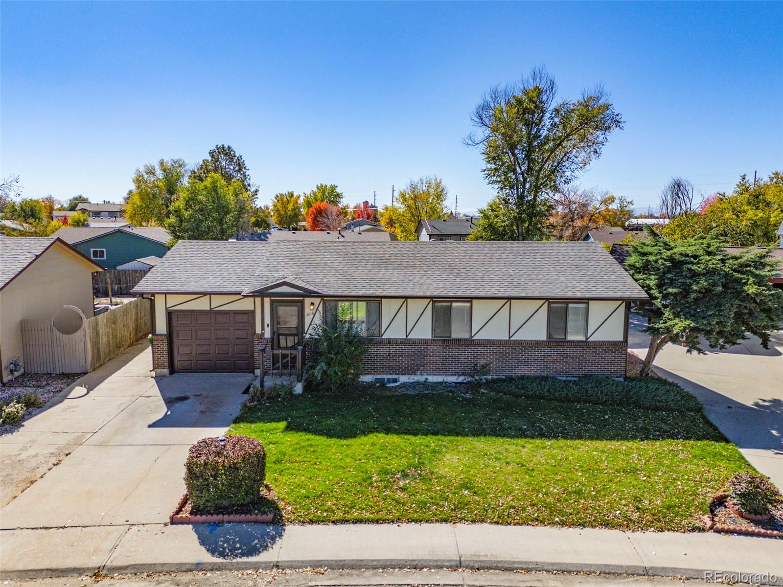 front view of a house with a small yard