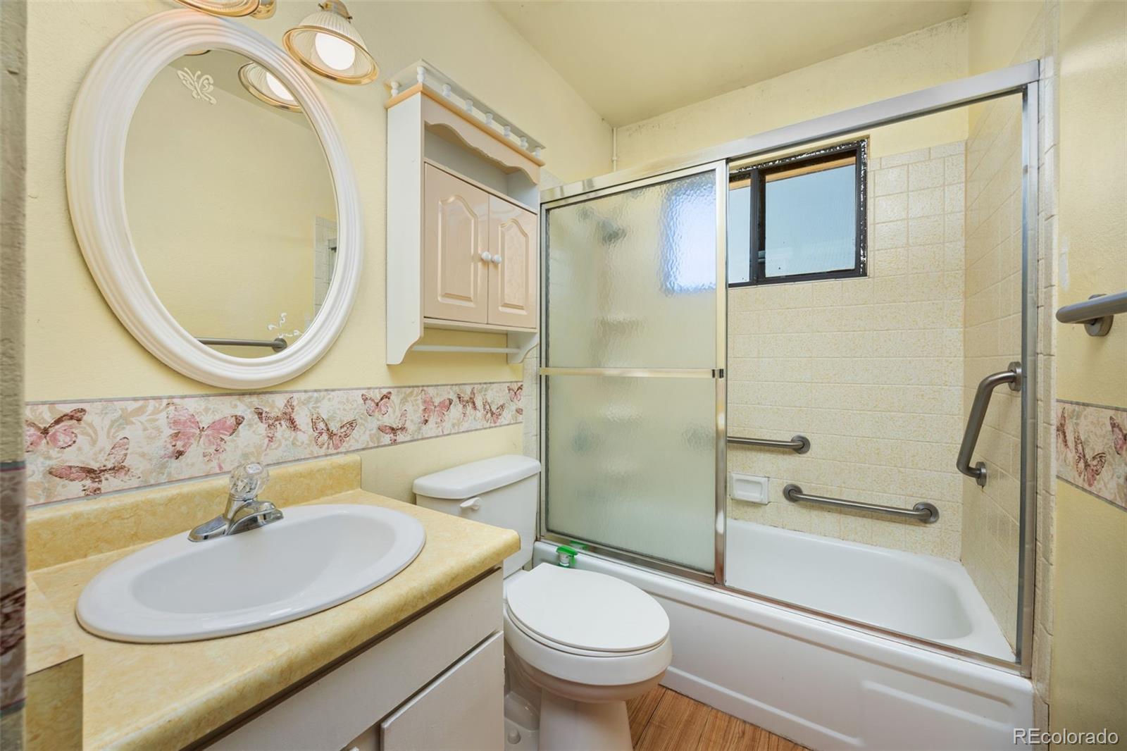 1006 Shortline Drive Fort Lupton, CO 80621 - Photo 15 of 33 a bathroom with a sink a toilet and shower
