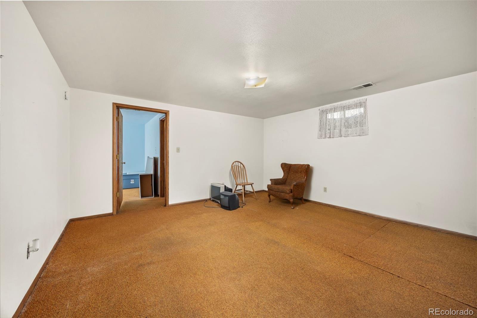 1006 Shortline Drive Fort Lupton, CO 80621 - Photo 16 of 33 a view of a room with gym equipment