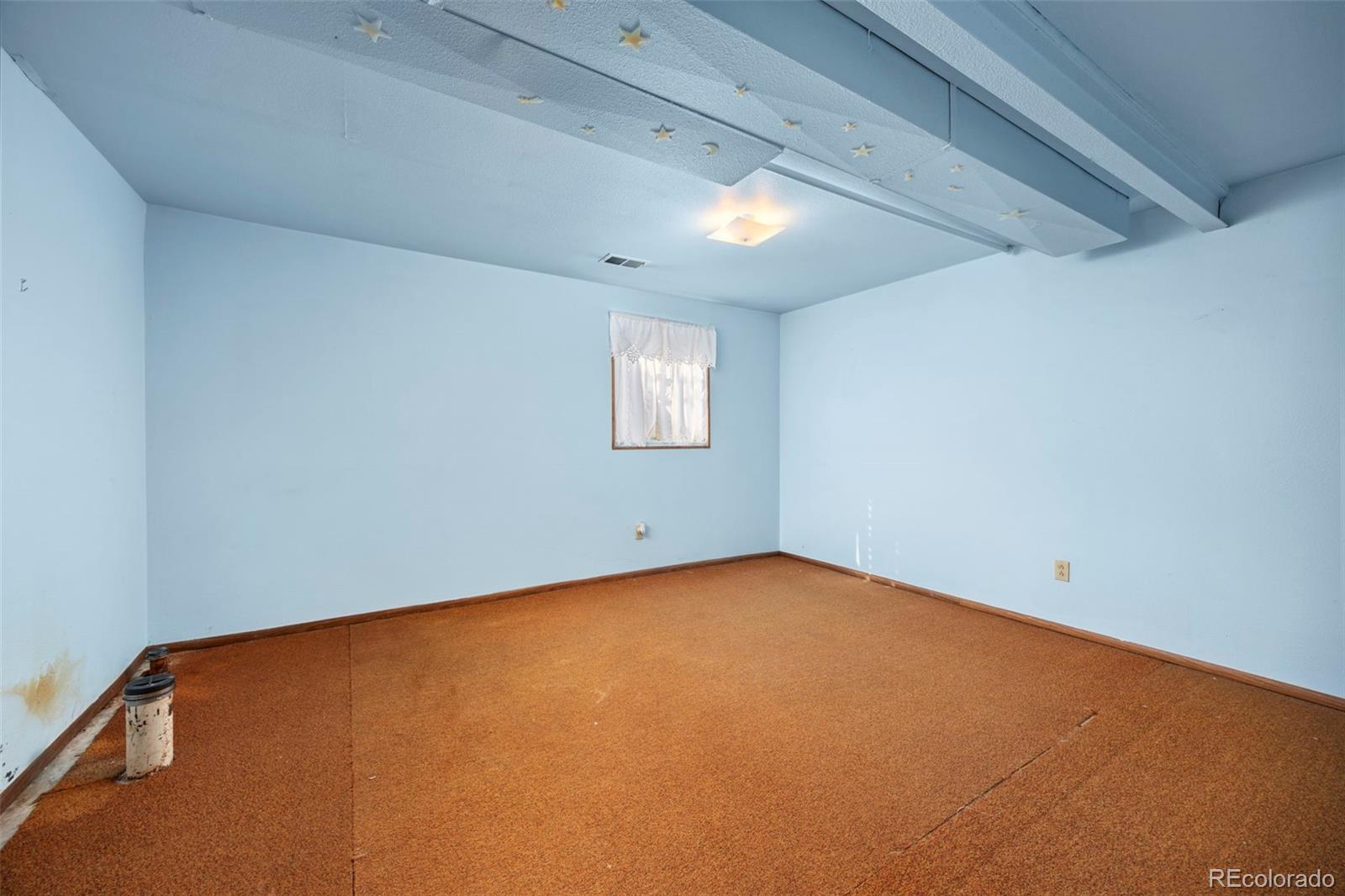 1006 Shortline Drive Fort Lupton, CO 80621 - Photo 18 of 33 an empty room with a window