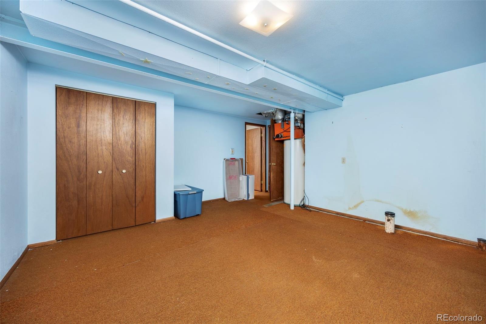 1006 Shortline Drive Fort Lupton, CO 80621 - Photo 19 of 33 a bedroom with a bed and cabinets