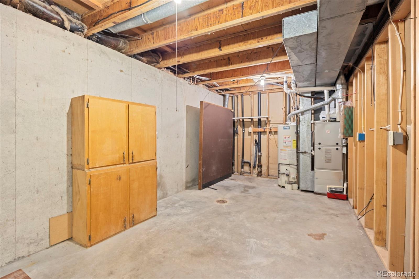 1006 Shortline Drive Fort Lupton, CO 80621 - Photo 21 of 33 a view of empty room with wooden walls