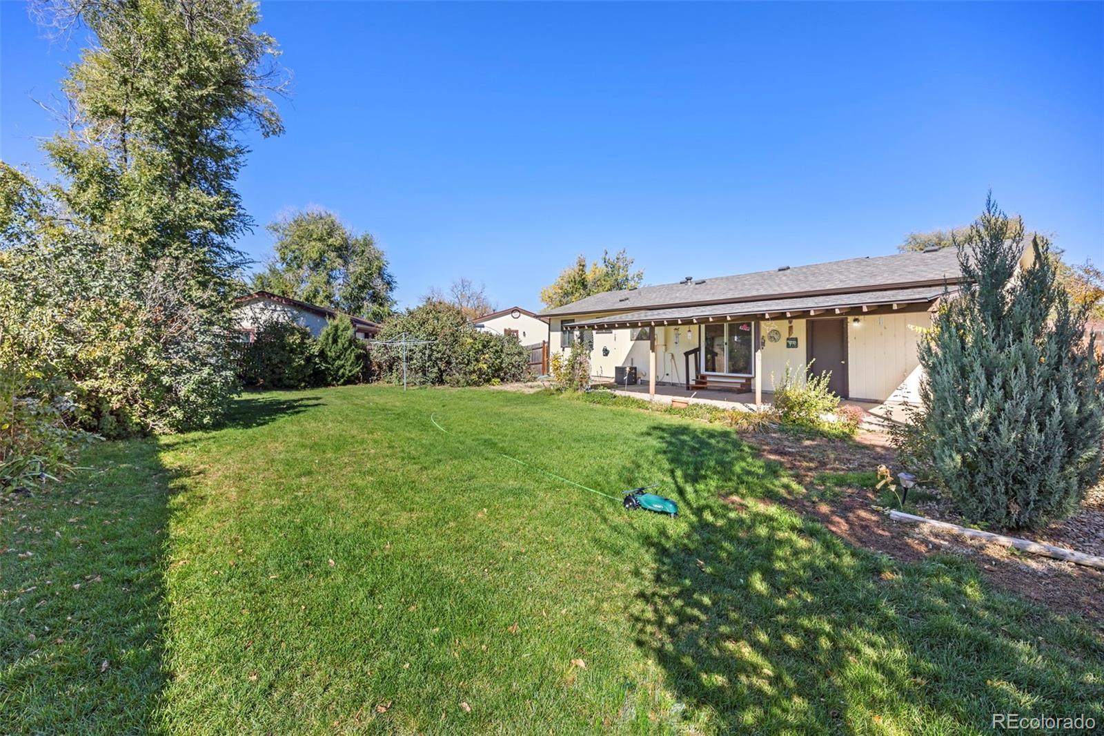 1006 Shortline Drive Fort Lupton, CO 80621 - Photo 25 of 33 a view of a house with yard and green space