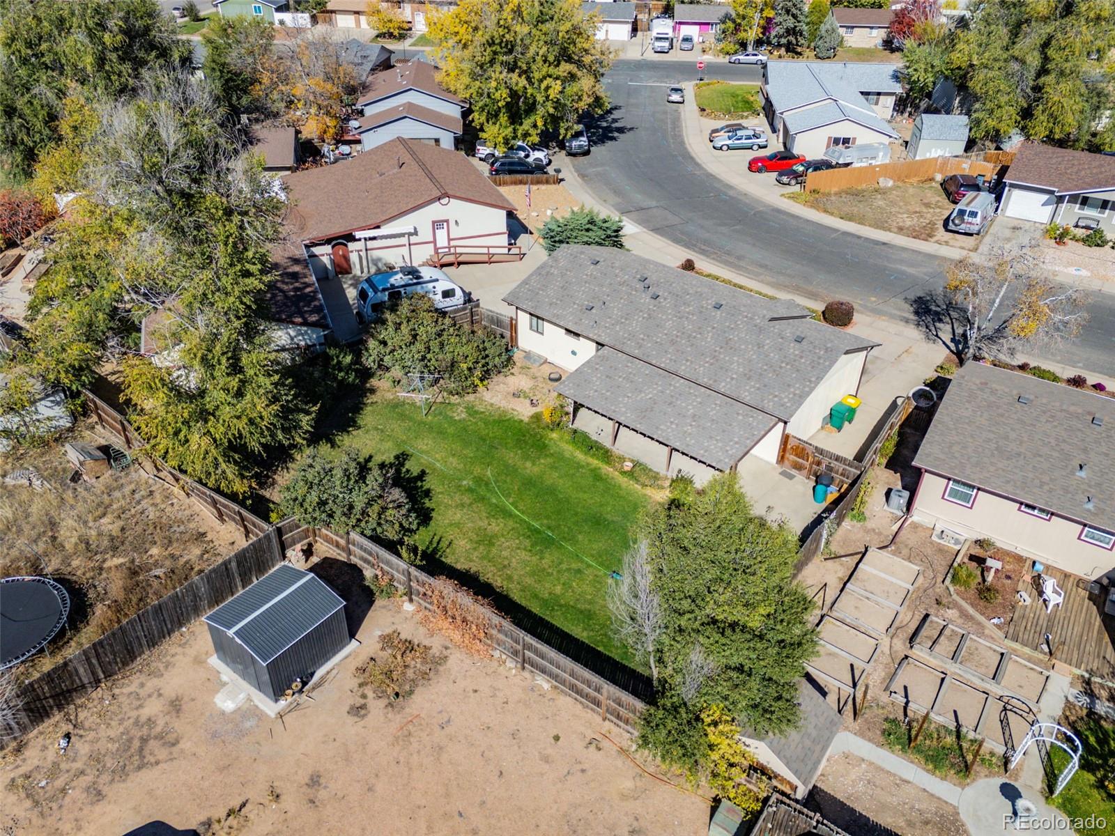 1006 Shortline Drive Fort Lupton, CO 80621 - Photo 26 of 33 an aerial view of residential house with outdoor space and swimming pool
