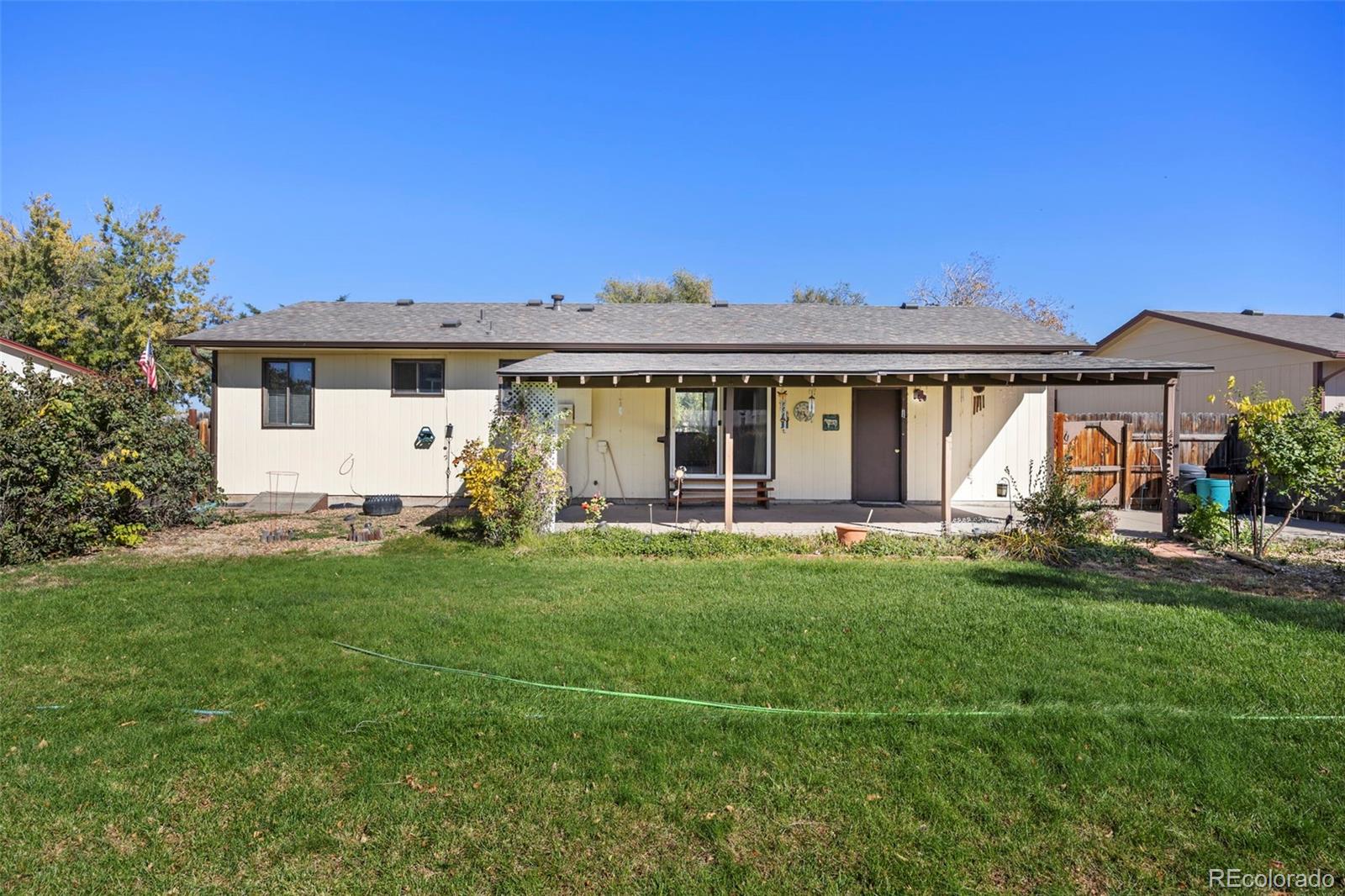 1006 Shortline Drive Fort Lupton, CO 80621 - Photo 27 of 33 front view of a house with a yard