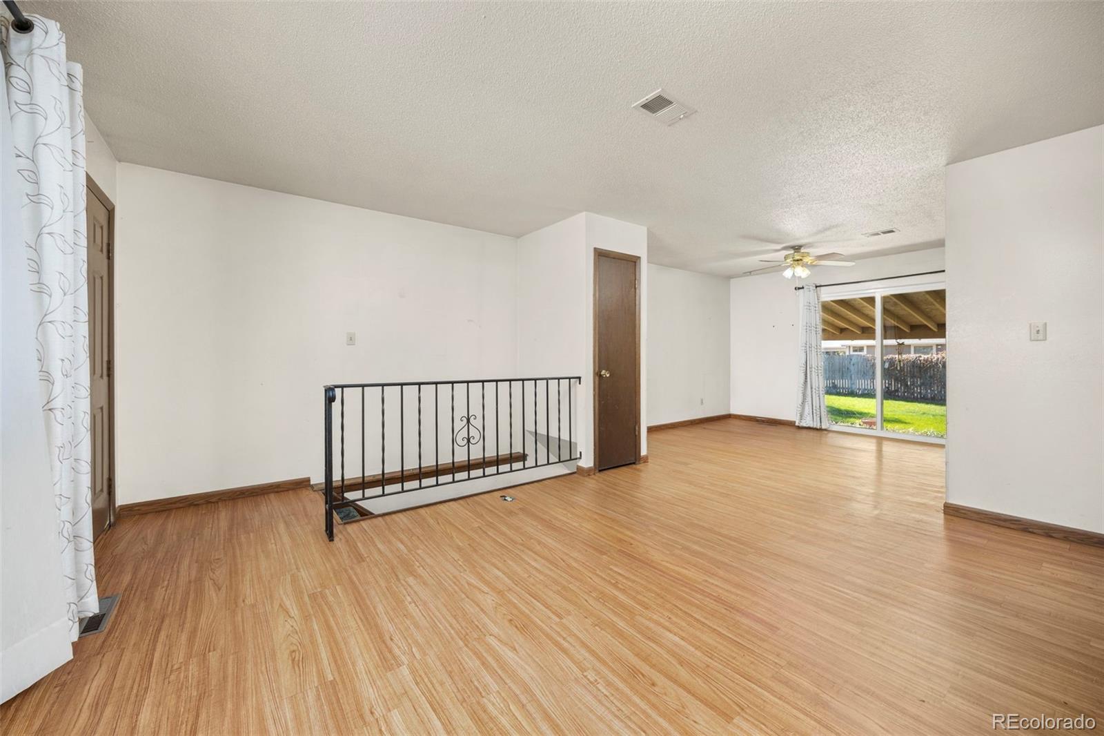 1006 Shortline Drive Fort Lupton, CO 80621 - Photo 7 of 33 a view of a room with wooden floor