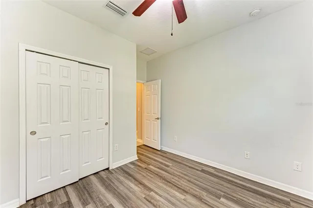 a view of a yard with a house in the background