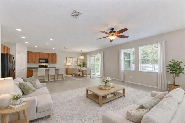 a view of a kitchen with a sink stainless steel appliances and cabinets
