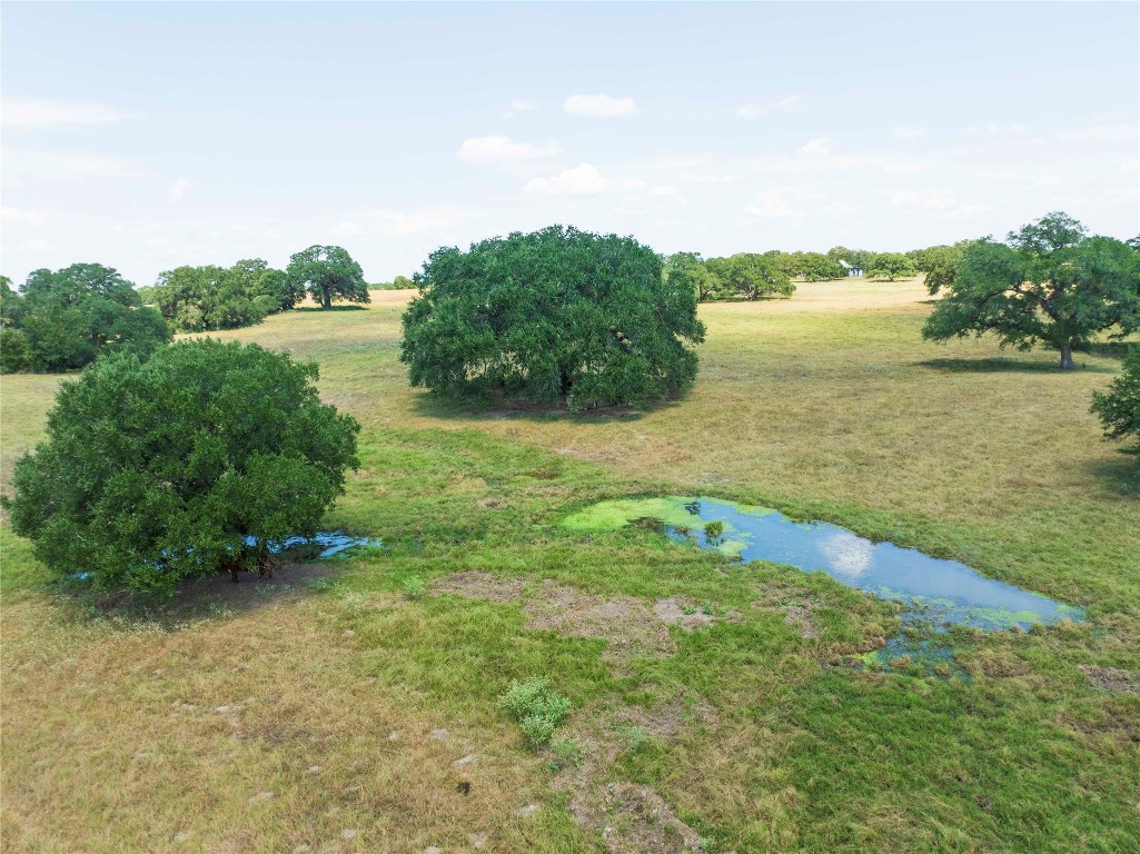 265 Boulton Creek Road Muldoon, TX 78949 - Photo 3 of 11 a view of a lake with houses in the back
