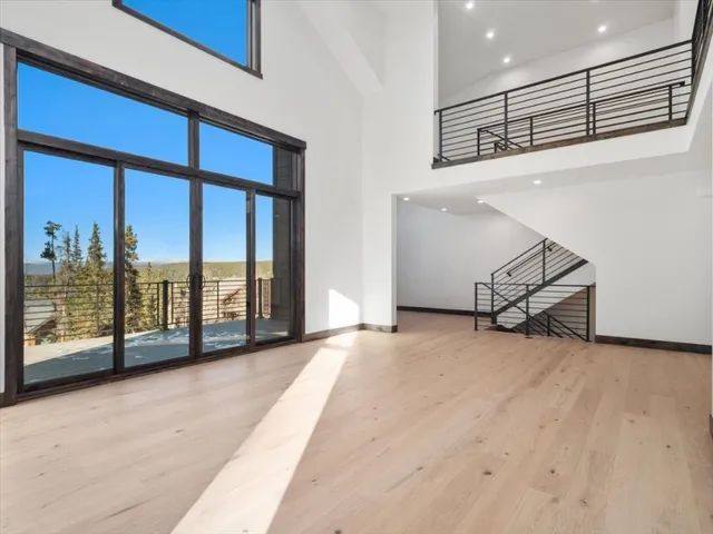 a view of an empty room with windows