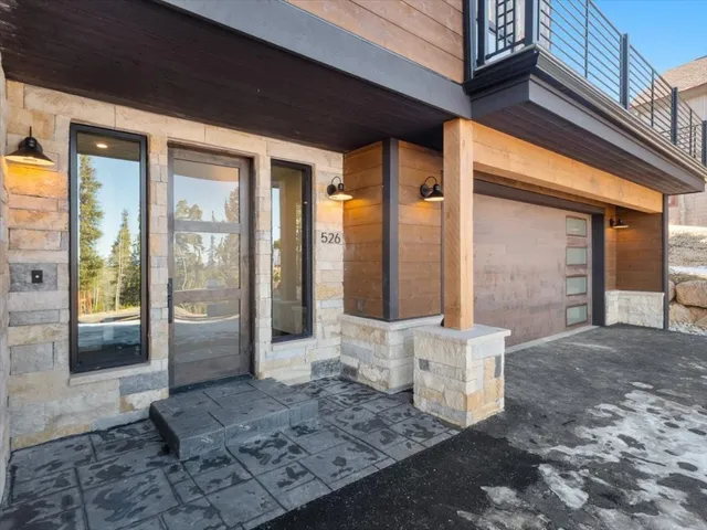 a view of a brick house with many windows