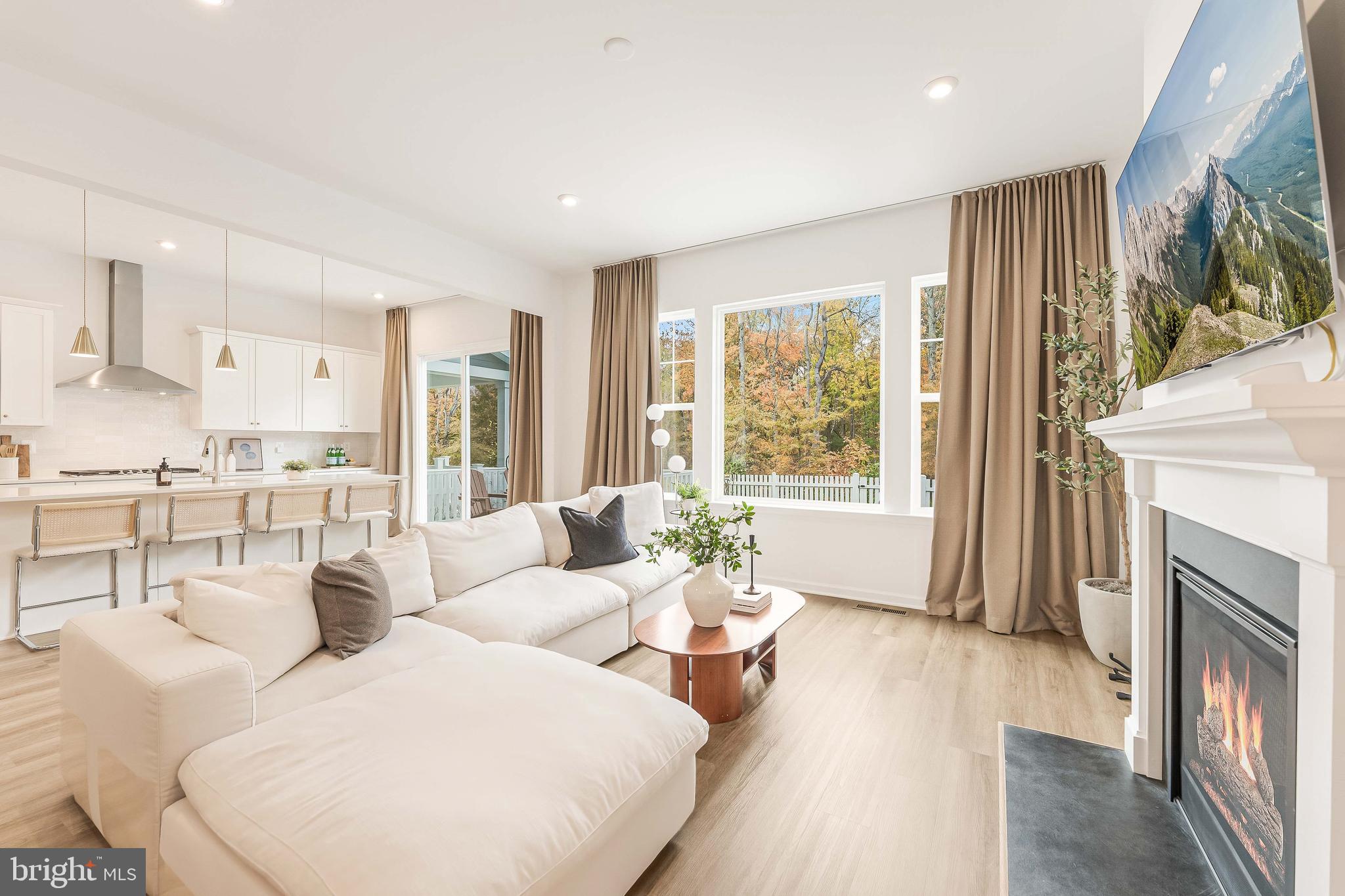 18260 Moss Garden Road Dumfries, VA 22026 - Photo 11 of 97 a living room with fireplace furniture and a large window